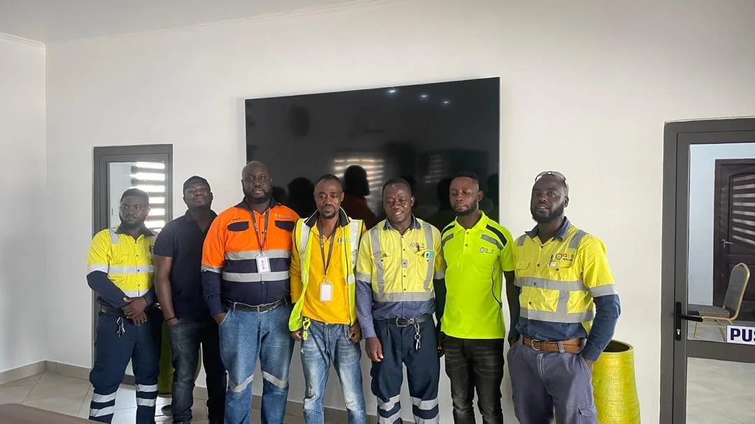 Client-supplied photograph of a workplace group indoors